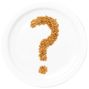 White plate with a question mark on it written in grains.