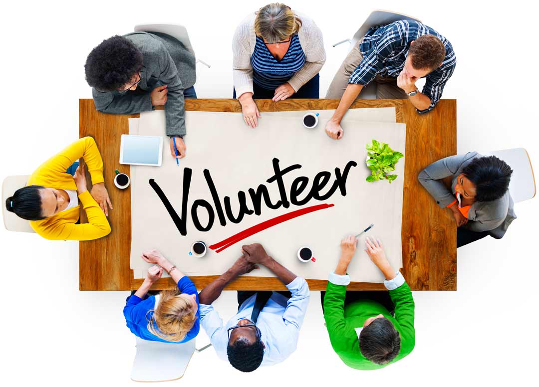 volunteers sitting at a community table